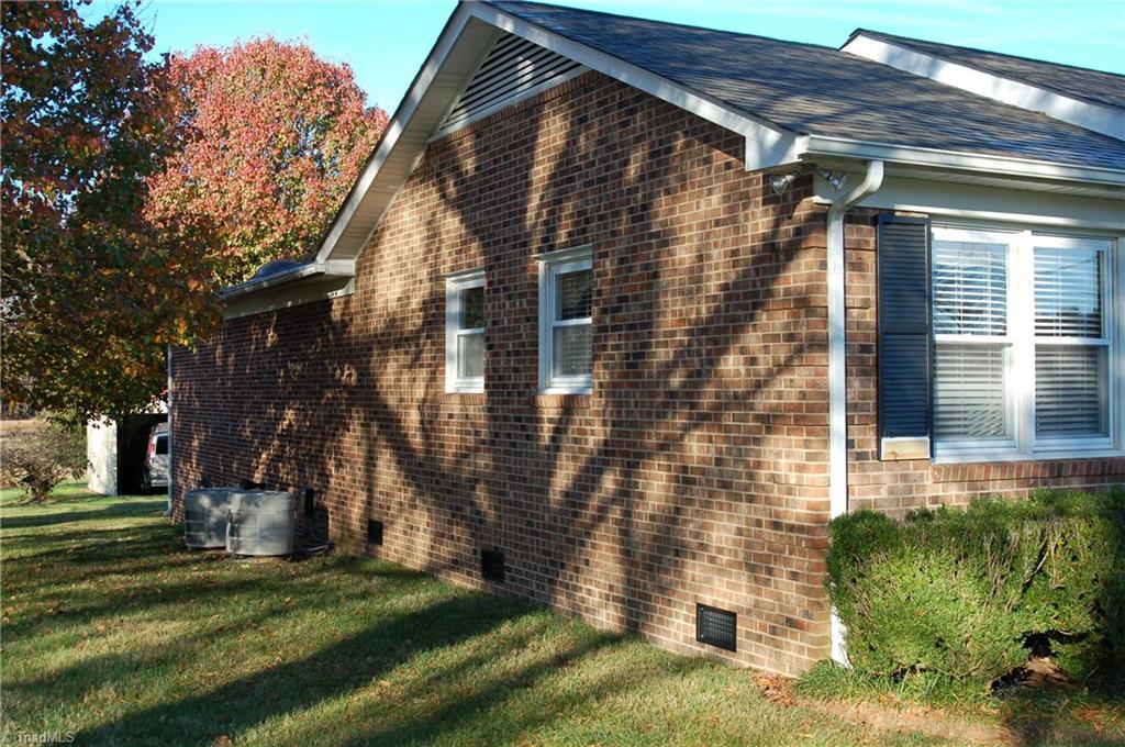 3945 Lewiston Road Summerfield, NC 27358 - Photo 15 of 18 Right Side of House