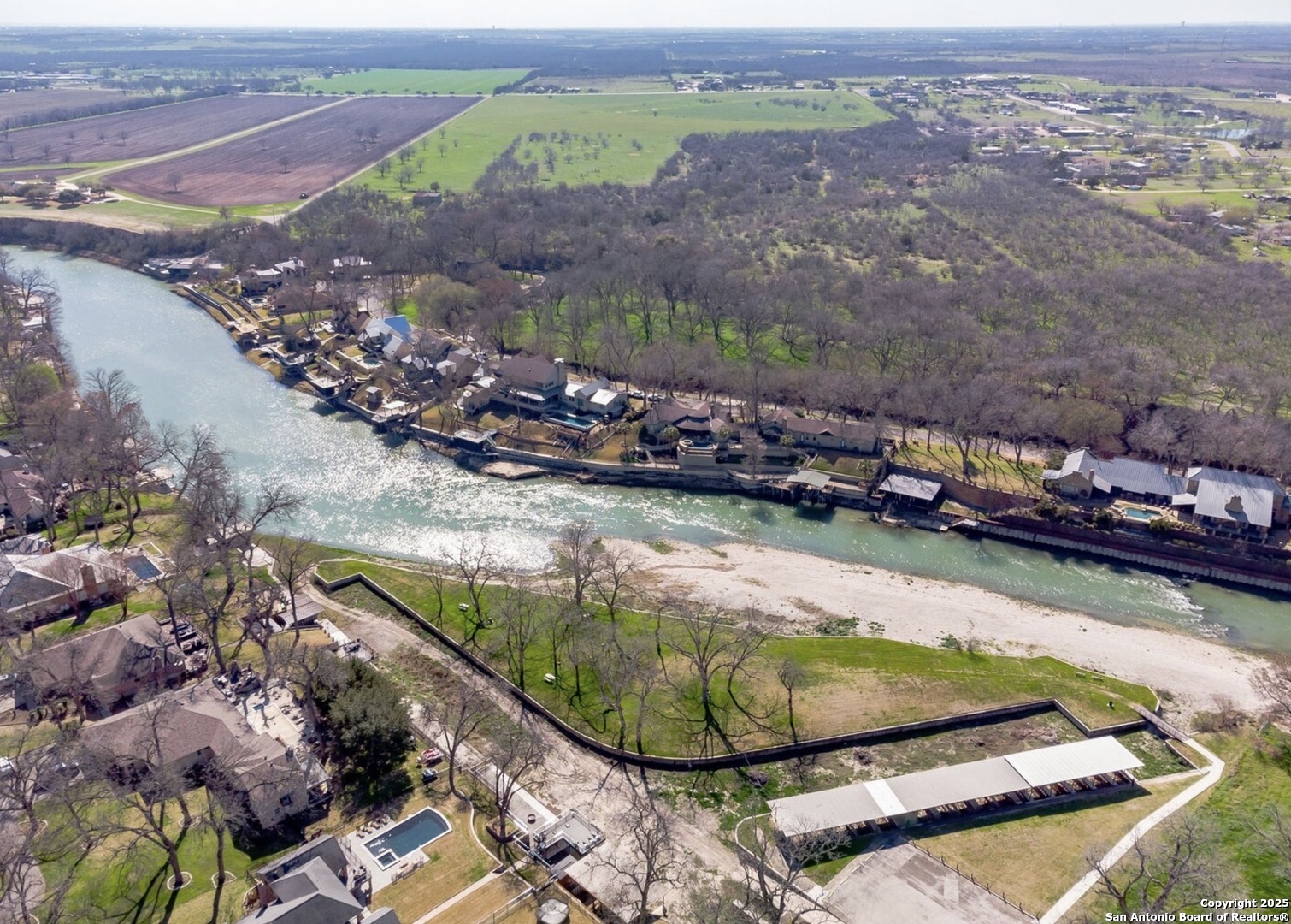 a view of a swimming pool with a yard