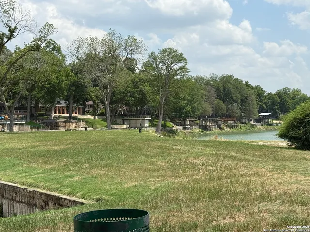 a view of a wooden deck with a yard