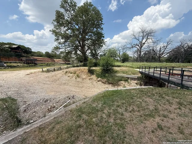a view of park with wooden fence