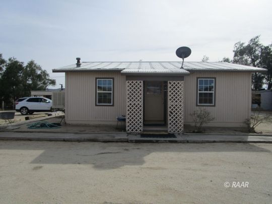 518 West Upjohn Avenue Ridgecrest, CA 93555 - Photo 1 of 24 a front view of a house with garage