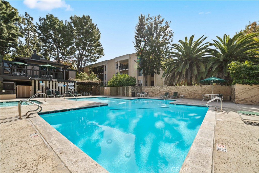 8108 Raintree Circle Culver City, CA 90230 - Photo 11 of 18 a swimming pool with outdoor seating and yard