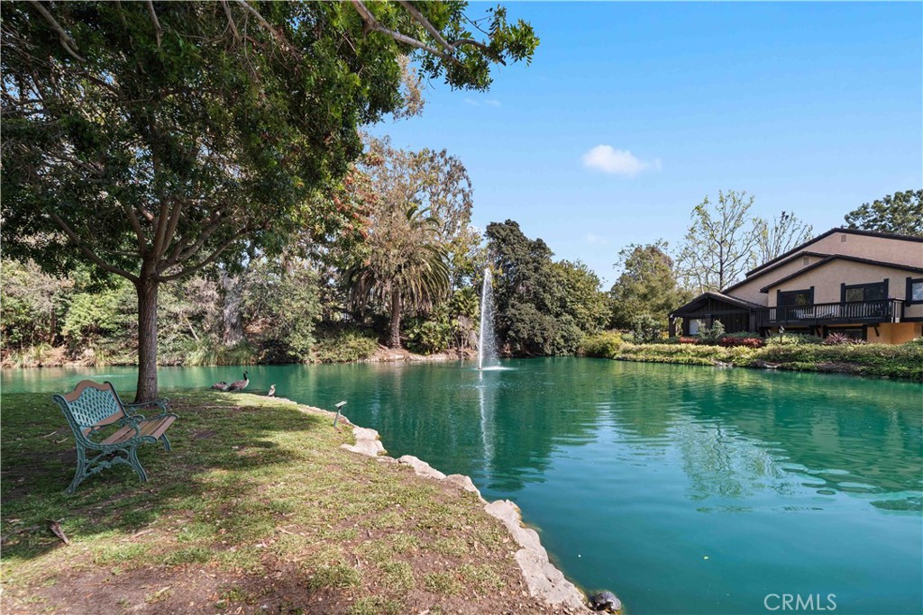 8108 Raintree Circle Culver City, CA 90230 - Photo 16 of 18 a view of a lake with a house in the background