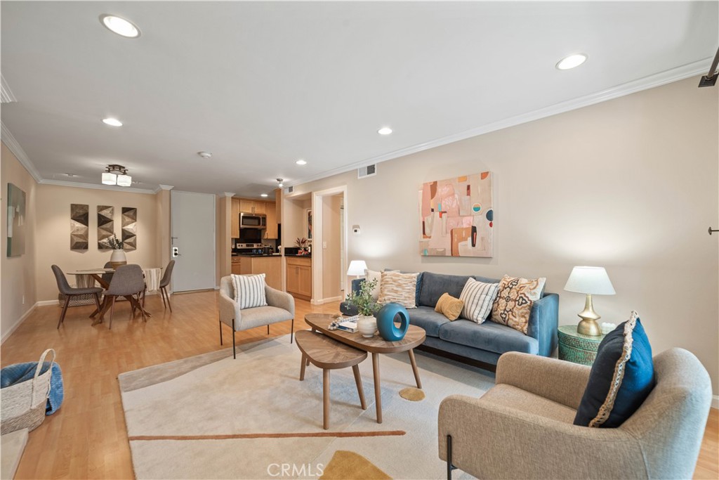 8108 Raintree Circle Culver City, CA 90230 - Photo 2 of 18 a living room with furniture and wooden floor