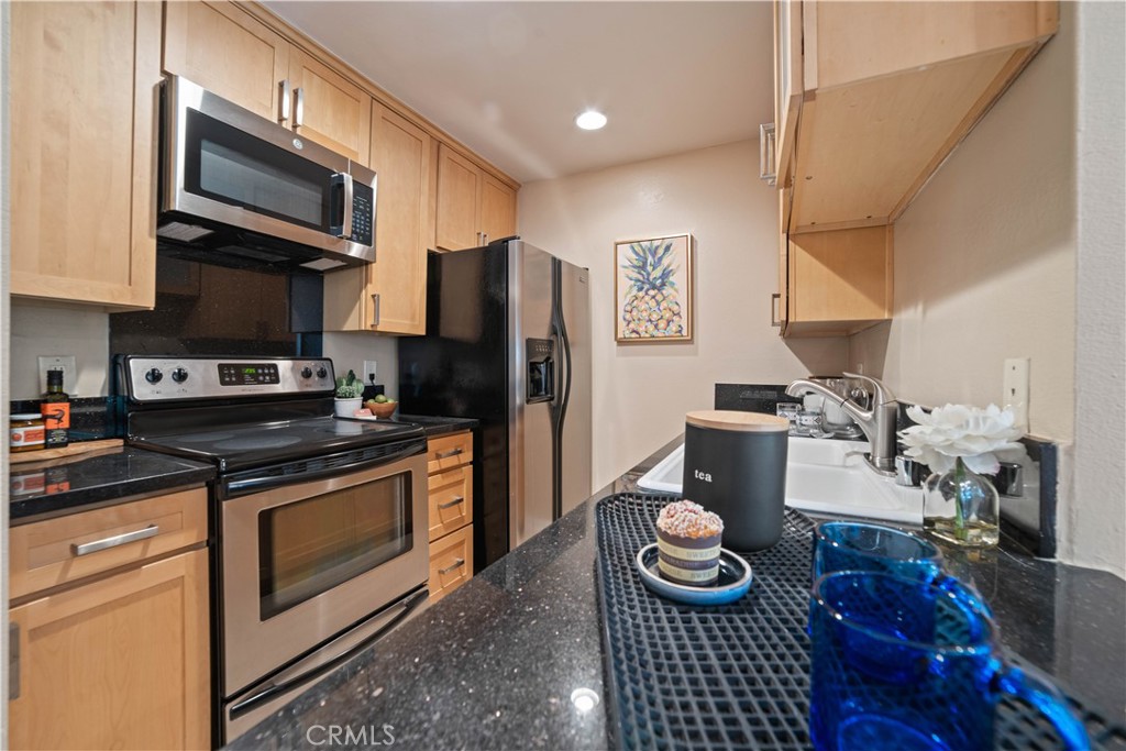 8108 Raintree Circle Culver City, CA 90230 - Photo 4 of 18 a kitchen with a stove and a refrigerator
