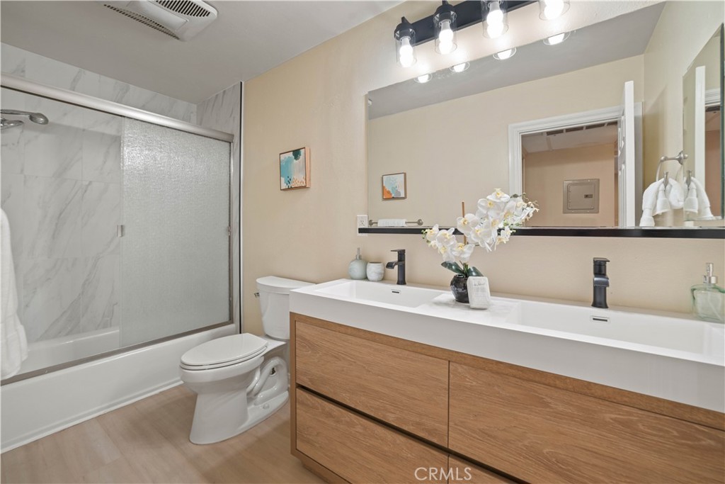 8108 Raintree Circle Culver City, CA 90230 - Photo 9 of 18 a bathroom with a sink a toilet and shower