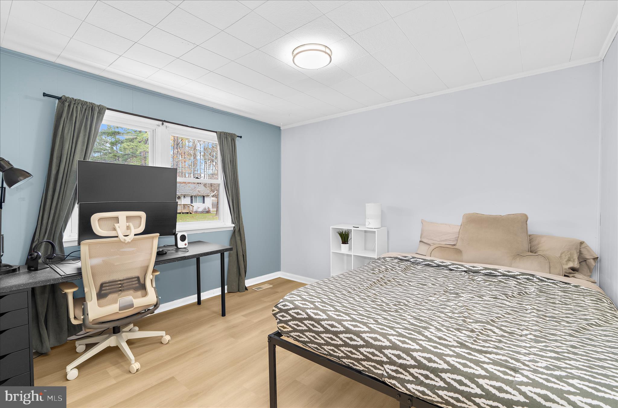 116 Talbot Road Stevensville, MD 21666 - Photo 20 of 33 a bedroom with a bed and wooden floor