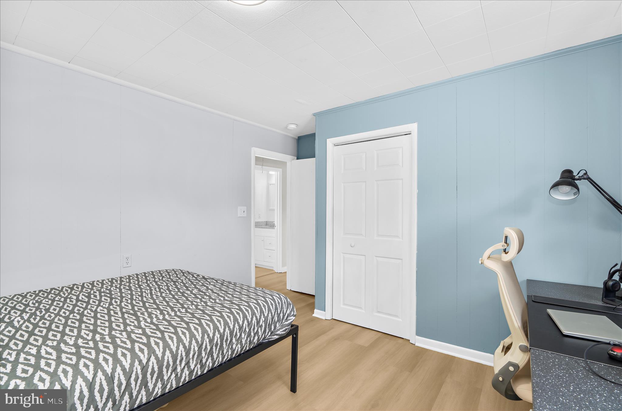 116 Talbot Road Stevensville, MD 21666 - Photo 21 of 33 a bed sitting in a room next to a window