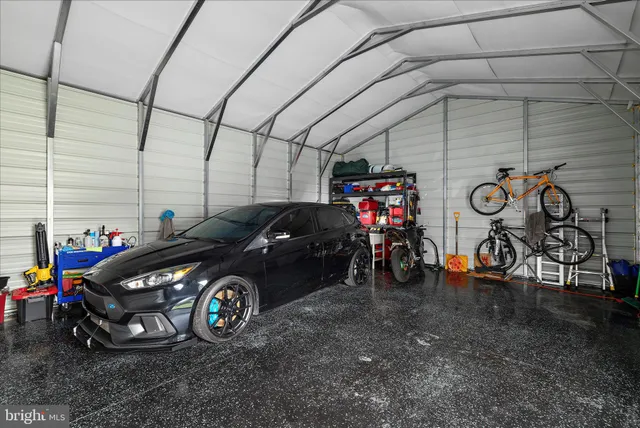 a view of a garage with parked cars