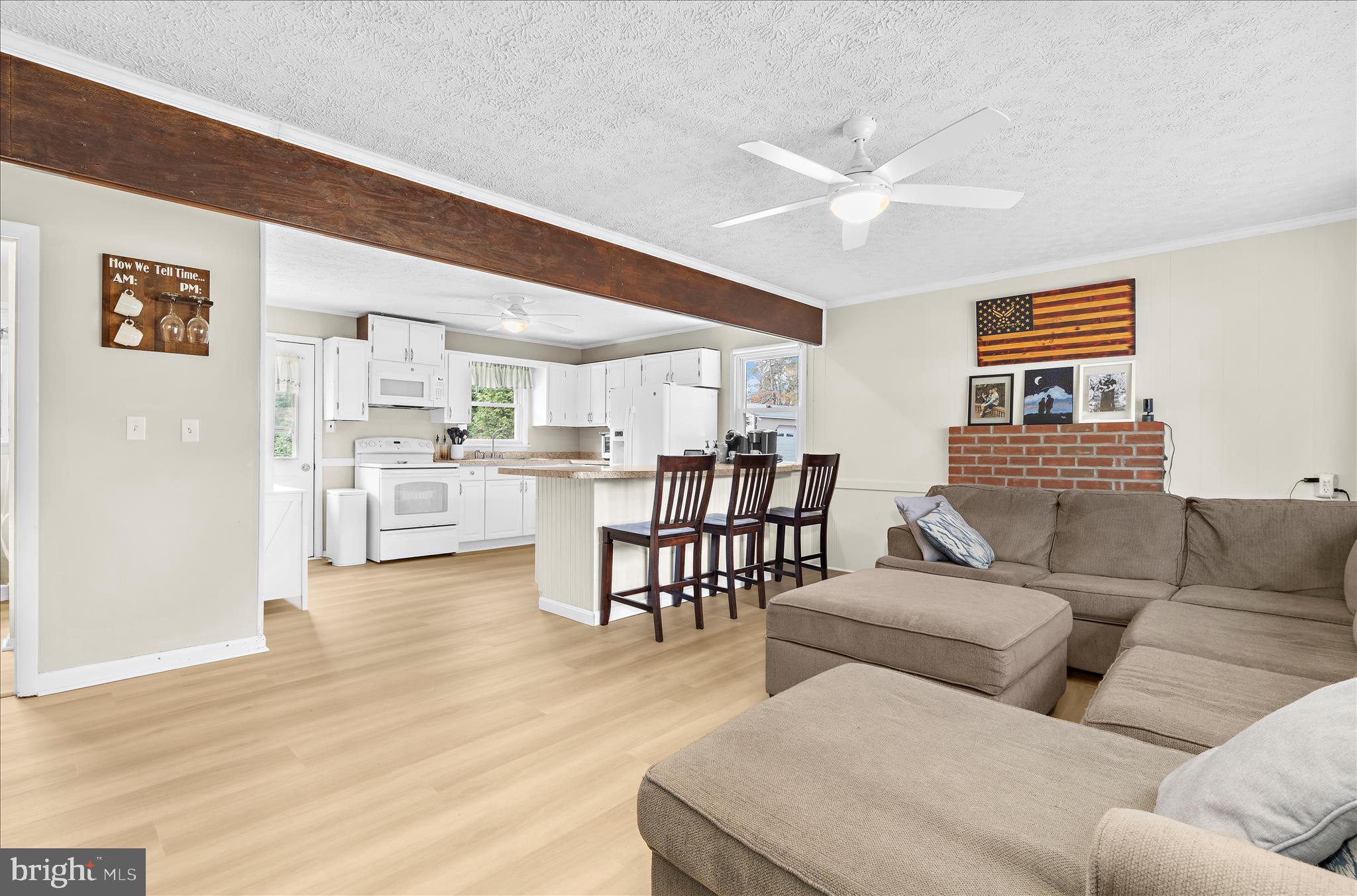 116 Talbot Road Stevensville, MD 21666 - Photo 5 of 33 a living room with furniture and kitchen view