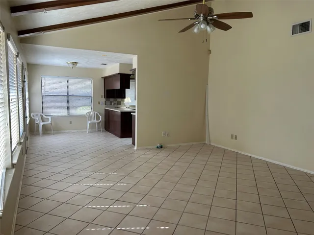 a view of a kitchen with a sink and cabinets