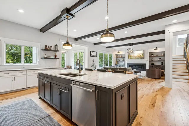 a white stove top oven sitting inside of a kitchen