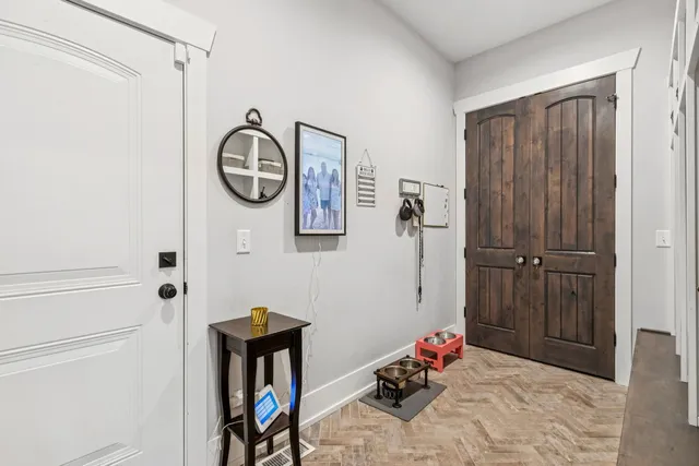 a bedroom with a bed couch and a window