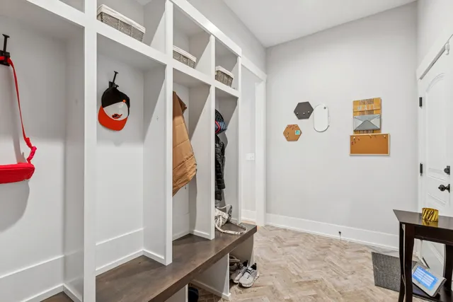 a bedroom with a bed a flat screen tv and cabinets