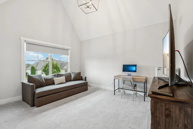 a living room with a sink and a table