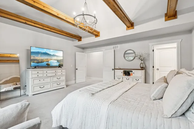 a bathroom with a toilet a sink a vanity and mirror