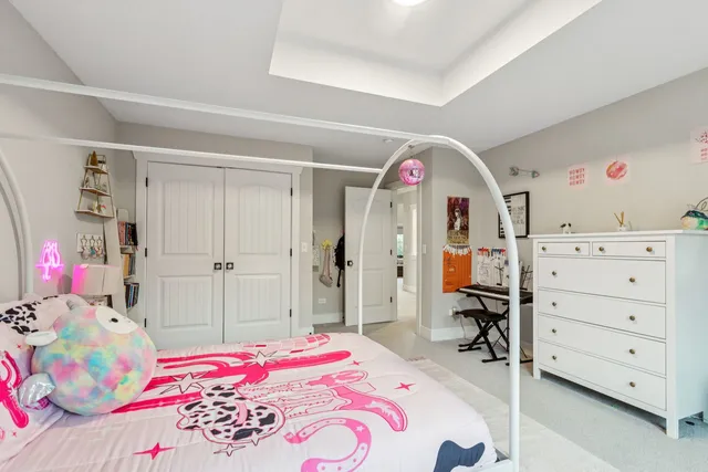 a bathroom with a toilet a sink a vanity and mirror