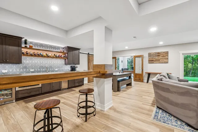 an aerial view of a house with backyard