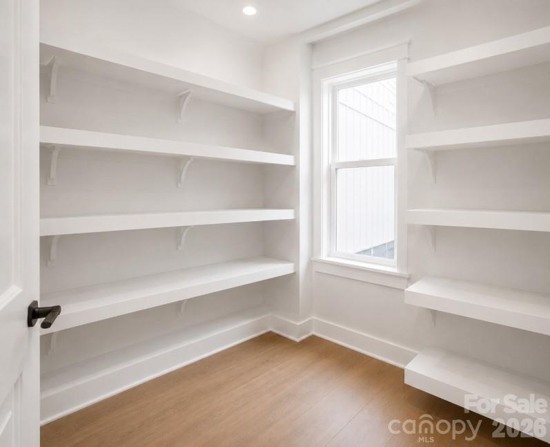 9745 Flowes Store Road Midland, NC 28107 - Photo 11 of 20 a view of walk in closet with empty racks