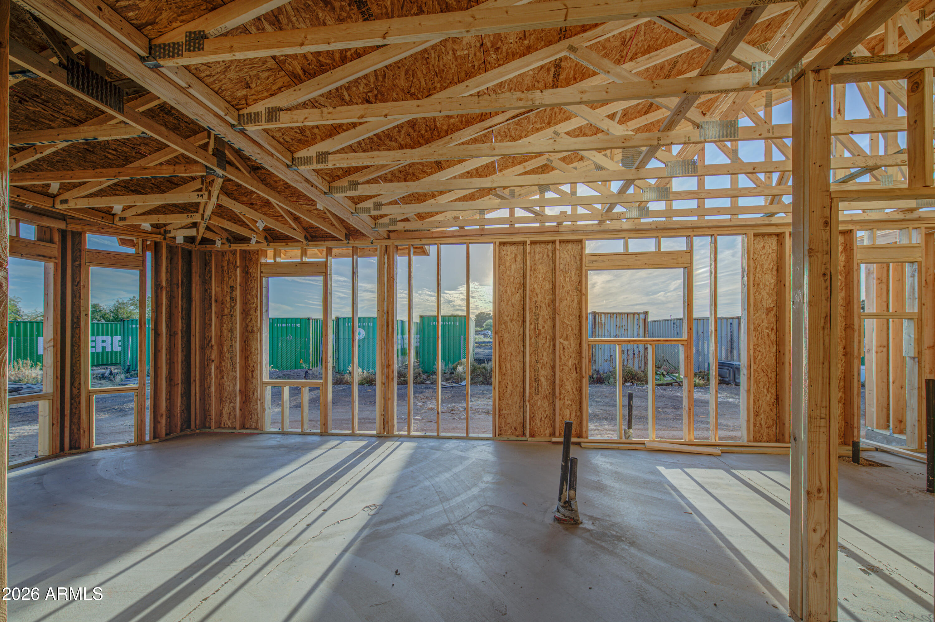 10931 West Lower Buckeye Road Tolleson, AZ 85353 - Photo 10 of 18 a view of an empty room with wooden floor and windows