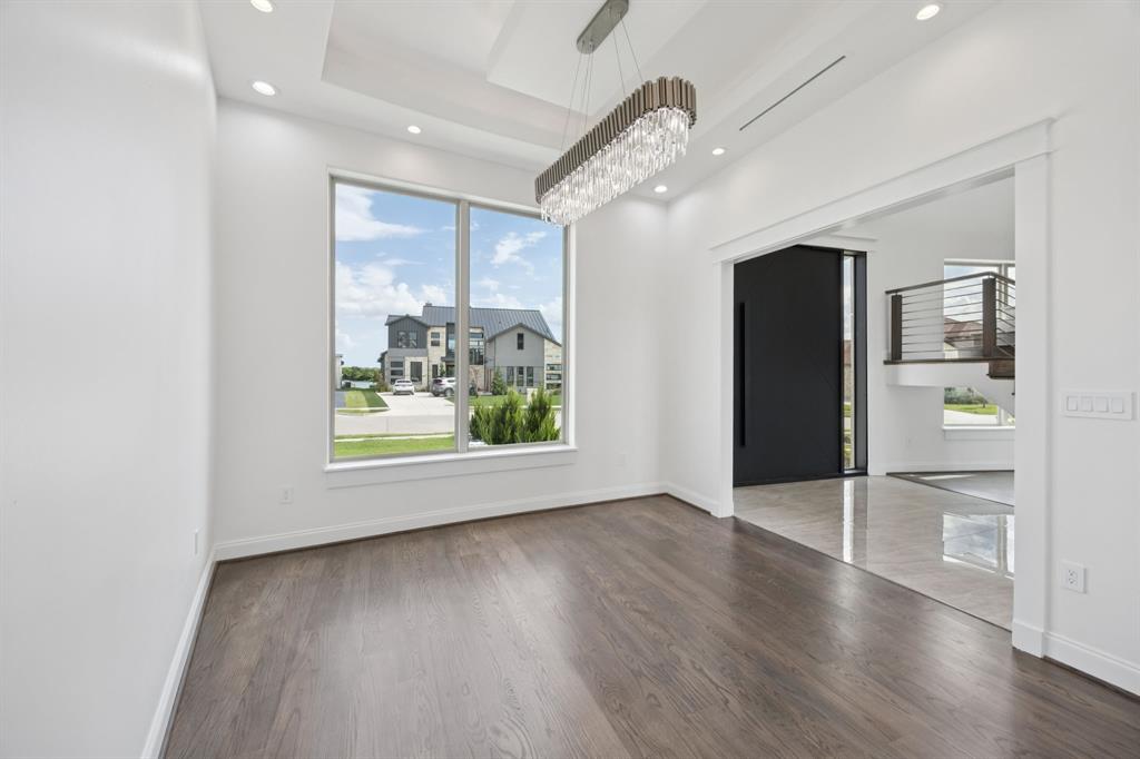 1933 Noe Boulevard Heath, TX 75126 - Photo 24 of 40 Formal dining area with luxurious chandelier