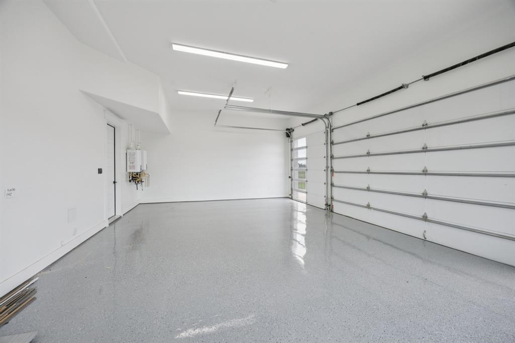 1933 Noe Boulevard Heath, TX 75126 - Photo 28 of 40 3 car garage with epoxy flooring