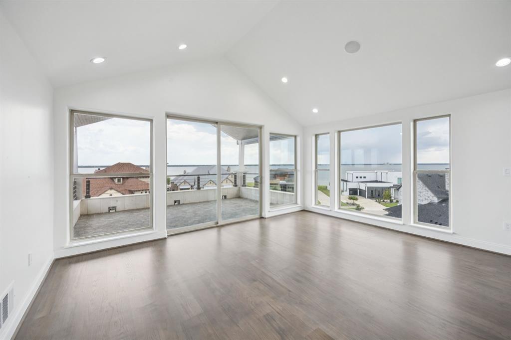 1933 Noe Boulevard Heath, TX 75126 - Photo 37 of 40 3rd story observation balcony and sunroom, loft or office with refrigerator, sink and island