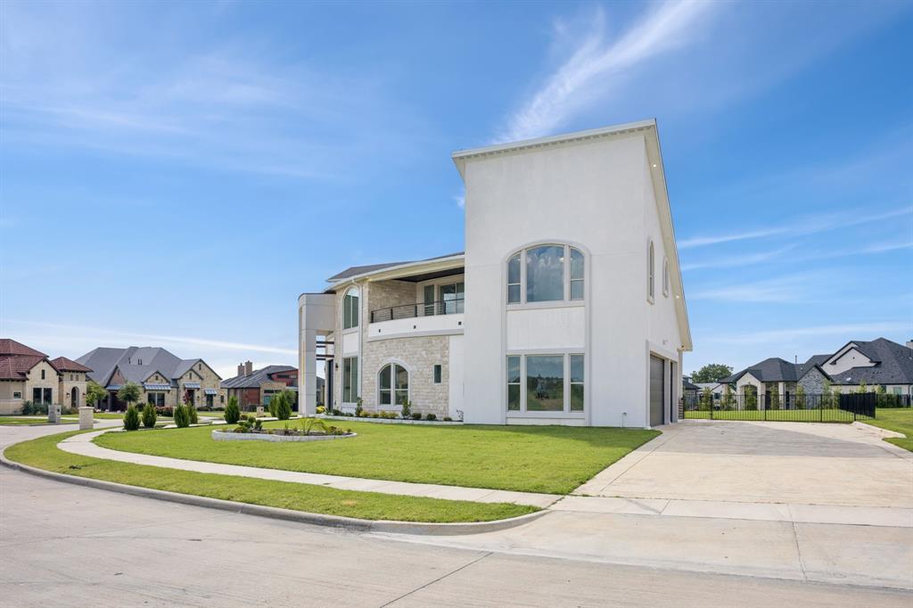 1933 Noe Boulevard Heath, TX 75126 - Photo 7 of 40 Expansive home with a generous driveway to park up to 9 cars