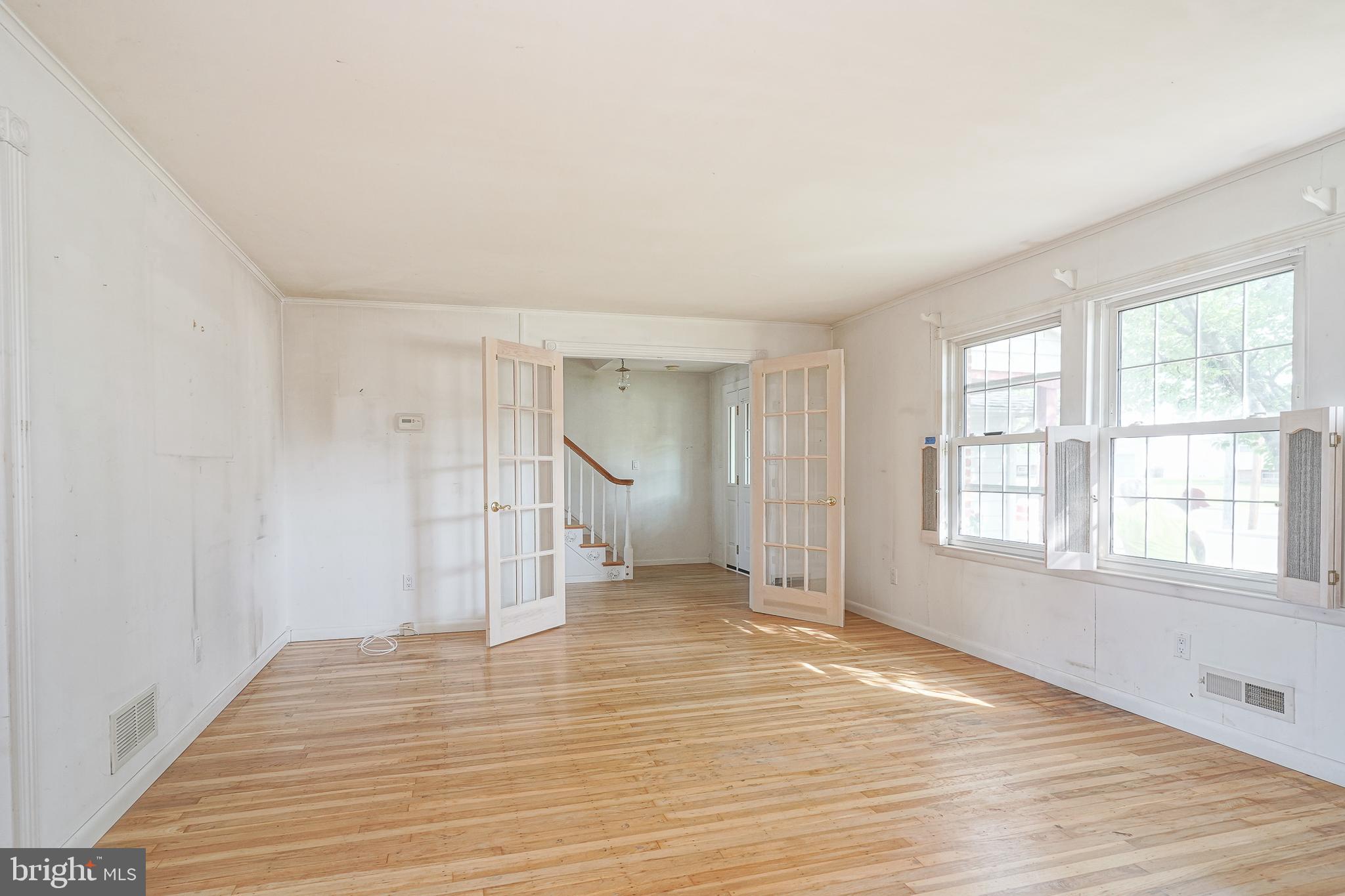 152 Kelly Driver Road Laurel Springs, NJ 08021 - Photo 5 of 30 an empty room with wooden floor and windows