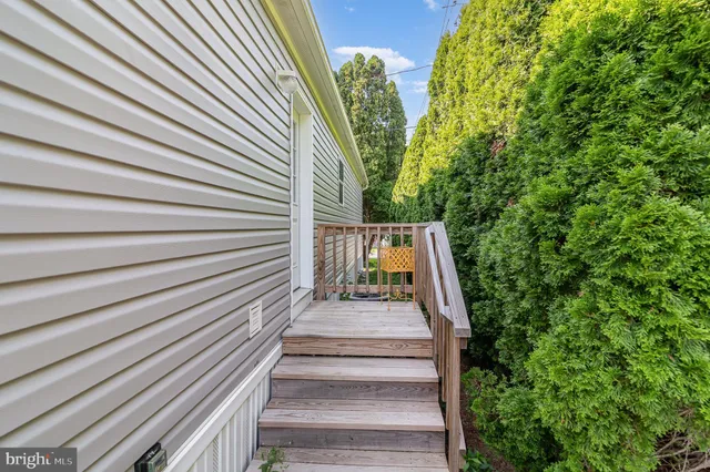 a view of a house with a yard and plants
