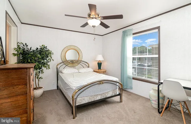 a bedroom with a bed and a chair