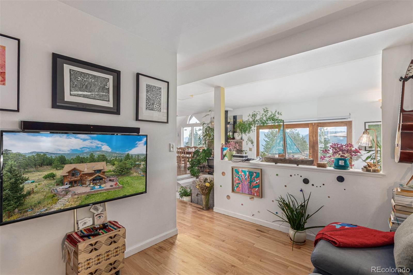 215 Lakeshore Park Road Boulder, CO 80302 - Photo 15 of 33 a living room with furniture fireplace and wooden floor