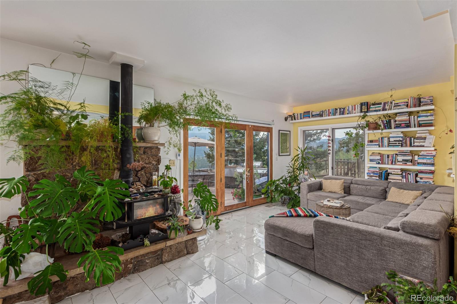 215 Lakeshore Park Road Boulder, CO 80302 - Photo 16 of 33 a living room with furniture and a potted plant