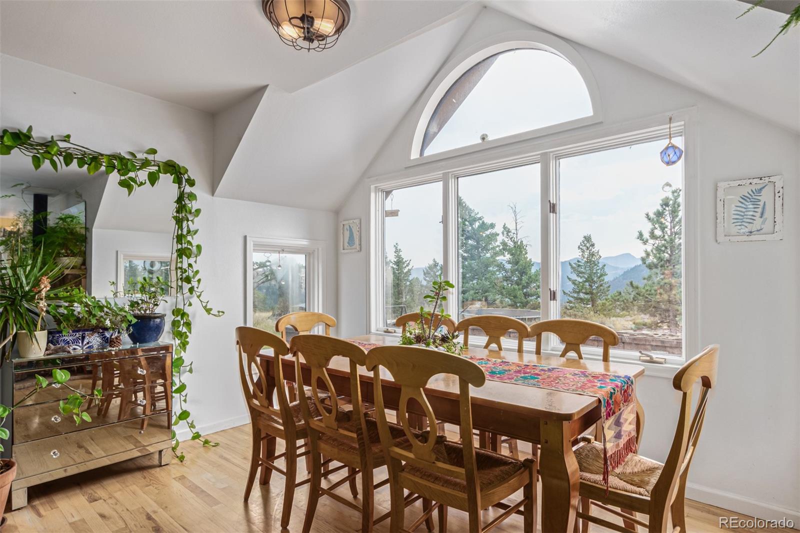 215 Lakeshore Park Road Boulder, CO 80302 - Photo 18 of 33 a view of a dining room with furniture window and wooden floor