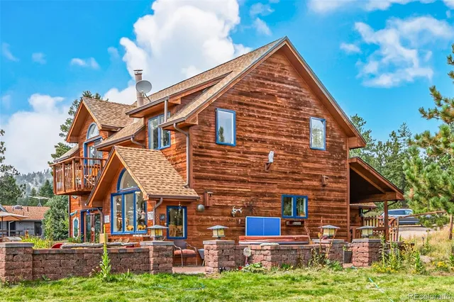a backyard of a house with sofas