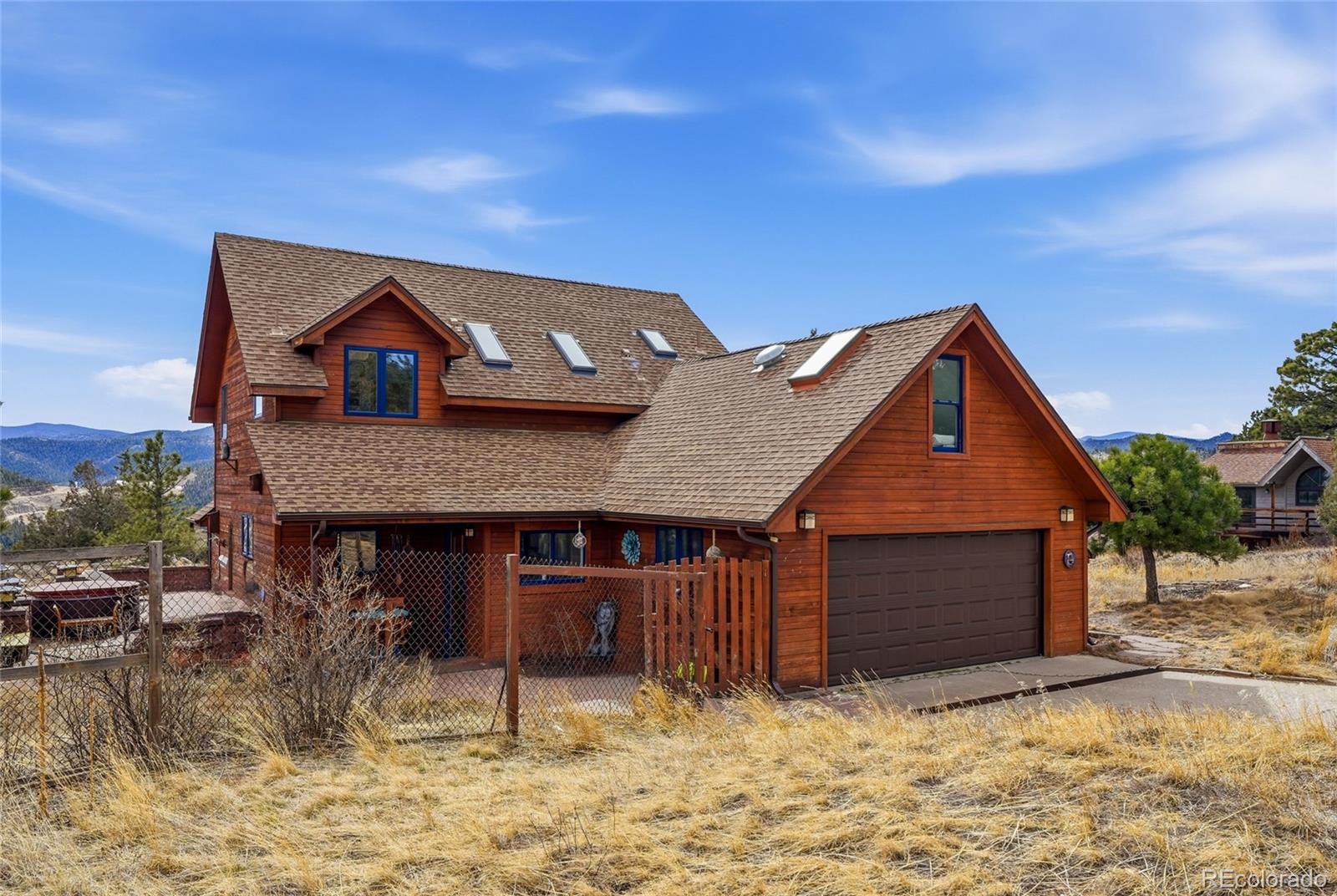 215 Lakeshore Park Road Boulder, CO 80302 - Photo 4 of 33 a front view of a house with a yard