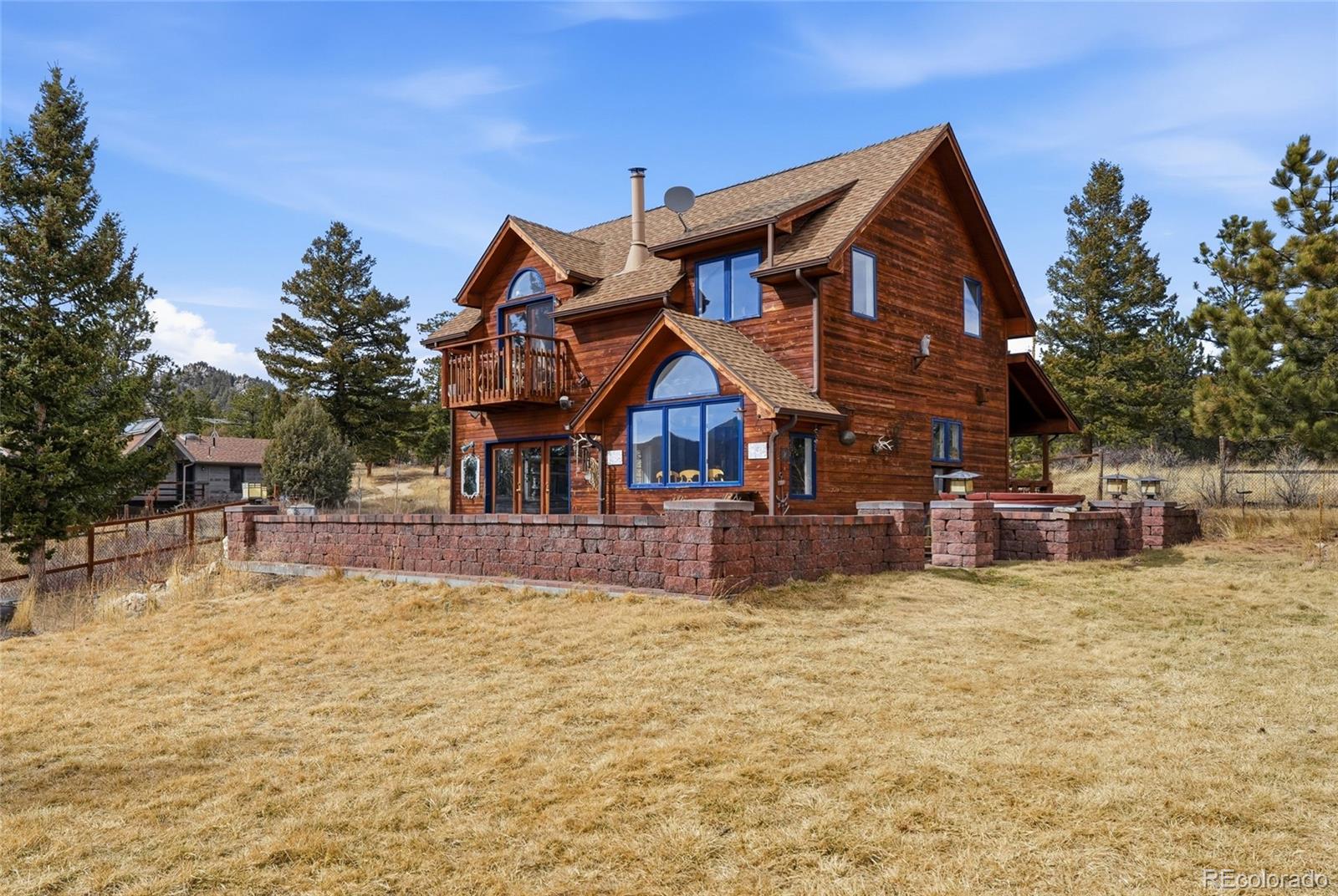 215 Lakeshore Park Road Boulder, CO 80302 - Photo 6 of 33 a view of a house with a big yard and sitting area