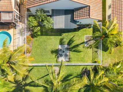 a view of a swimming pool with a yard