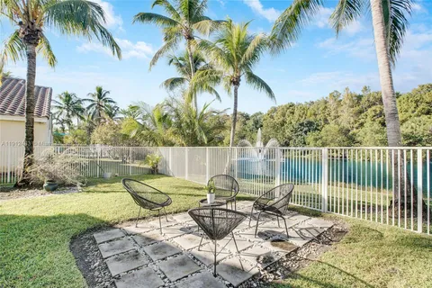 a view of a chair and tables in the patio