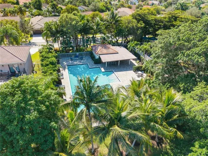 a wooden fence with some plants