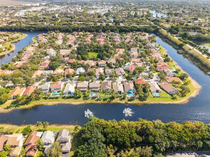 an aerial view of residential houses with outdoor space