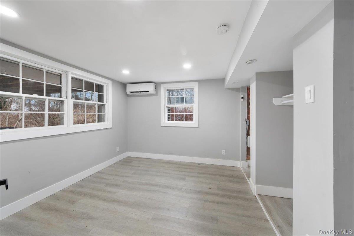 96 Fairmont Road Mahopac, NY 10541 - Photo 26 of 34 Den (basement) with neutral gray walls complemented by light wood-finish flooring