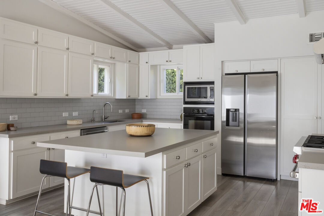 716 West Oak Avenue El Segundo, CA 90245 - Photo 12 of 35 a kitchen with cabinets and stainless steel appliances