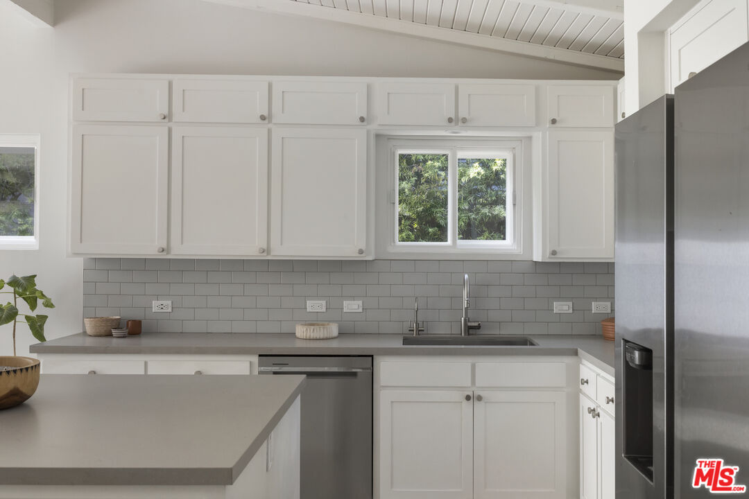 716 West Oak Avenue El Segundo, CA 90245 - Photo 14 of 35 a kitchen with stainless steel appliances granite countertop a sink a refrigerator and a granite counter tops