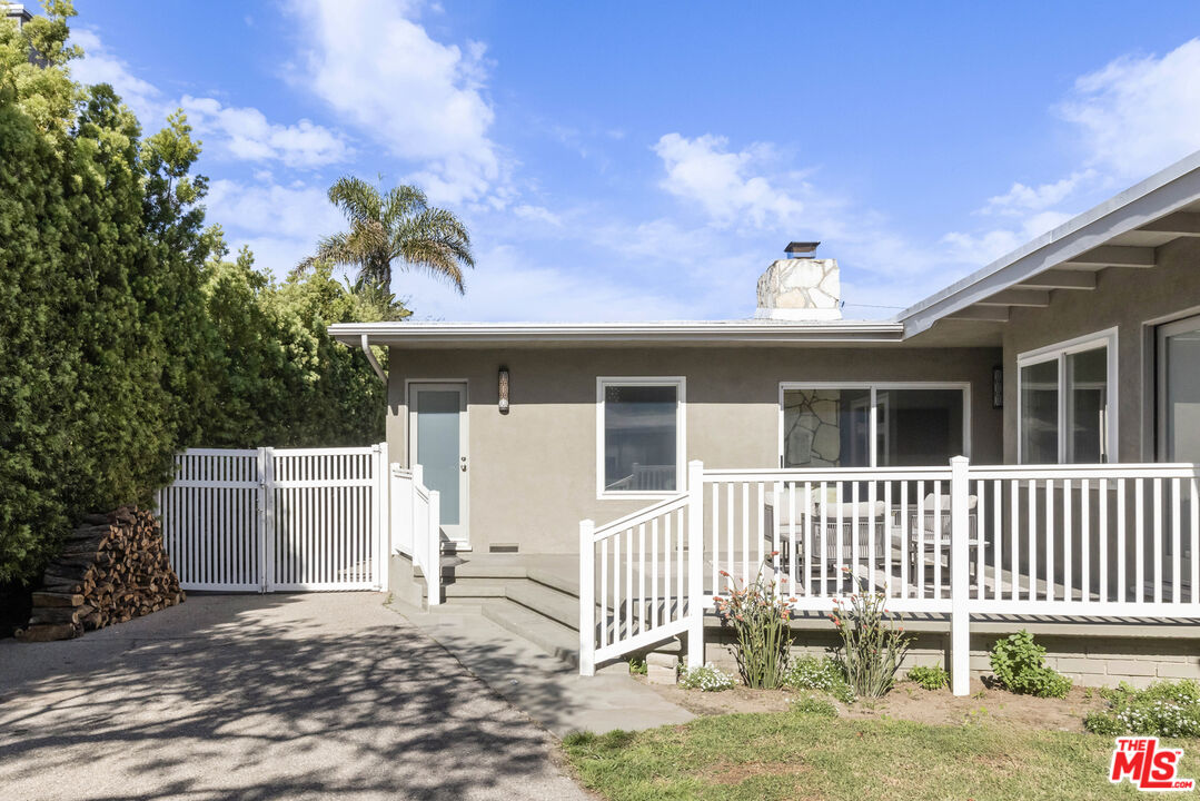 716 West Oak Avenue El Segundo, CA 90245 - Photo 32 of 35 a view of a house with a small yard and wooden fence