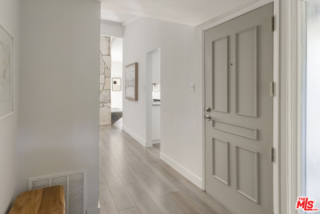 716 West Oak Avenue El Segundo, CA 90245 - Photo 4 of 35 a view of a hallway with wooden floor and closet