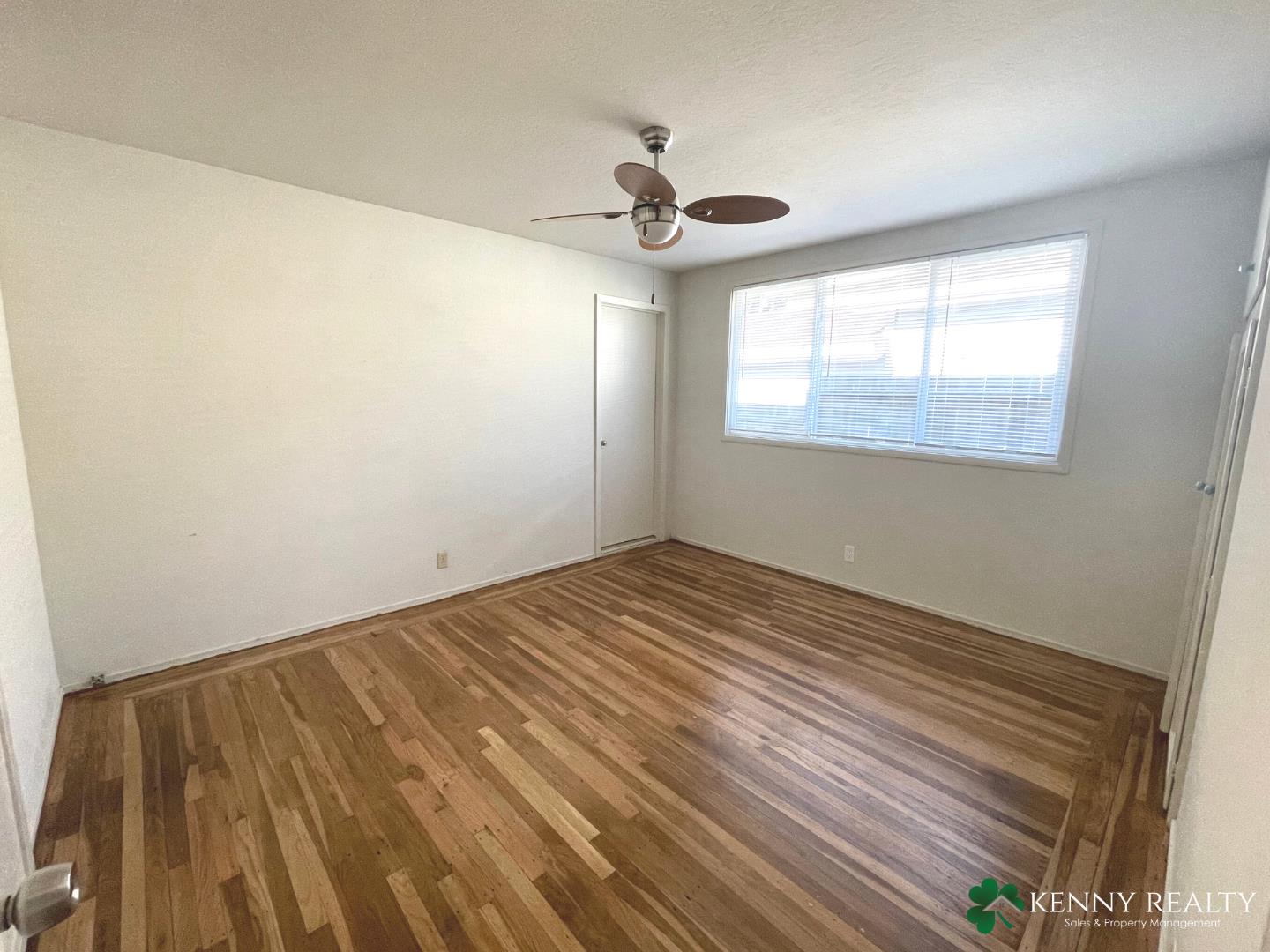 1059 Anza Drive Pacifica, CA 94044 - Photo 11 of 18 a view of empty room with wooden floor and fan