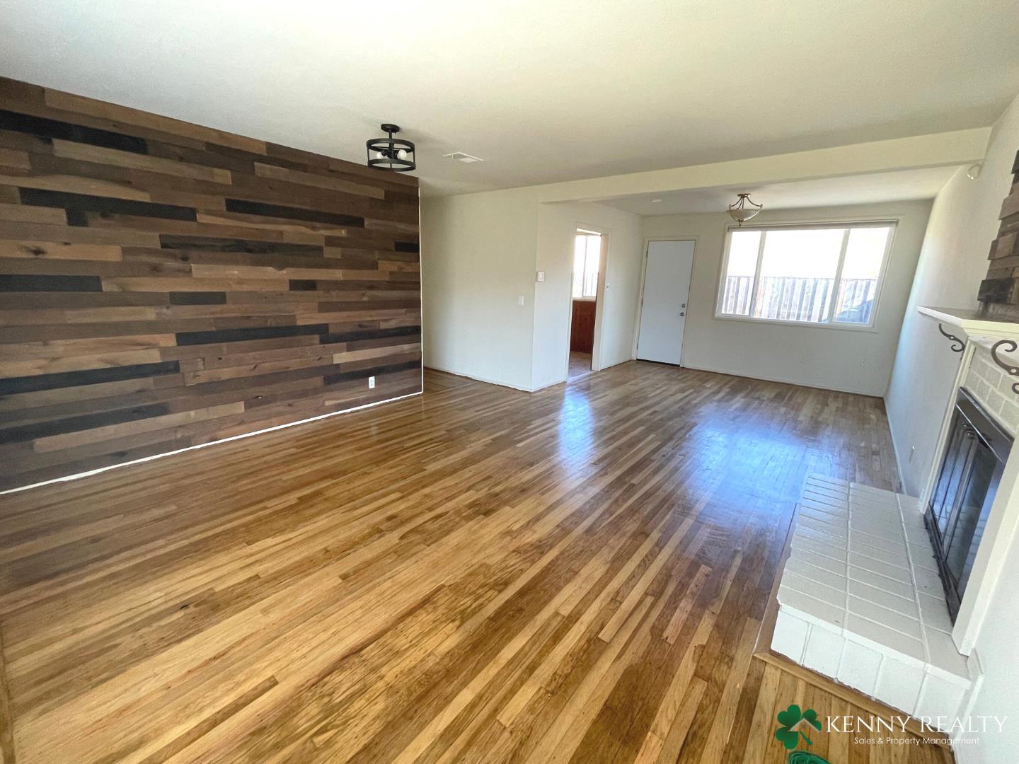 1059 Anza Drive Pacifica, CA 94044 - Photo 3 of 18 a view of empty room with wooden floor and fan