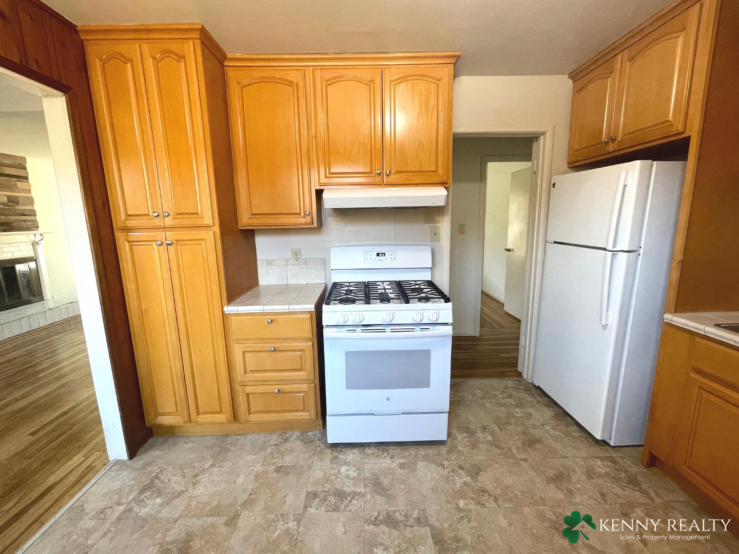 1059 Anza Drive Pacifica, CA 94044 - Photo 8 of 18 a kitchen with a refrigerator stove and a sink