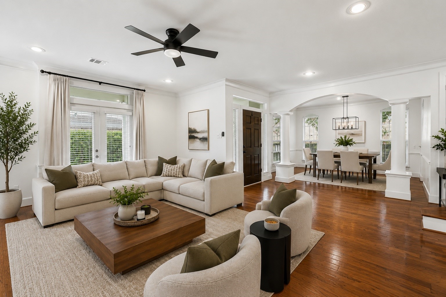1470 Springrock Lane, Unit 6 Houston, TX 77055 - Photo 5 of 31 This spacious living area features hardwood floors, a cozy fireplace, high ceilings, crown molding, and large windows that fill the room with natural light. Virtually staged.